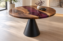 Round walnut epoxy table on pale oak flooring