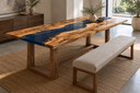 Olive-wood epoxy table beside an upholstered dining bench