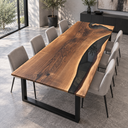 Angled view of a black walnut dining table with a curved black epoxy resin river