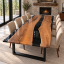 Angled view of a black walnut dining table with glossy black epoxy resin borders and a central river