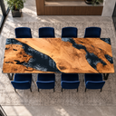 Overhead horizontal view of a poplar dining table with golden wood grain, black epoxy resin and gray swirls, surrounded by blue chairs.