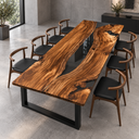Angled view of a walnut dining table with sweeping grain around a tapered black epoxy resin river