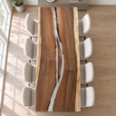 Overhead lengthwise view of a walnut tabletop with a branching clear epoxy resin channel