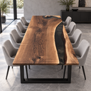 Front view of a black walnut dining tabletop with an off-center black resin channel