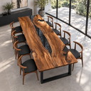 Opposite corner view of a walnut tabletop with a glossy black epoxy resin channel and natural wood contours