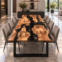 Front view of an olive wood and black epoxy resin dining table with flowing grain and irregular wood islands.