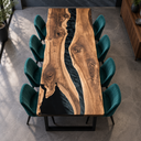 Overhead lengthwise view of black walnut grain and a flowing black resin channel