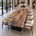 Black walnut dining table with black epoxy resin channels and gold-toned detailing, viewed diagonally beside tall windows.