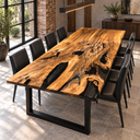 Angled view of a figured walnut dining table with glossy black epoxy resin filling natural openings