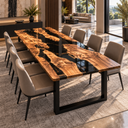 Olive wood and black epoxy resin dining tabletop viewed diagonally in an open-plan dining room.