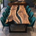 Front view of a black walnut dining table with a black epoxy resin river and natural outer edges