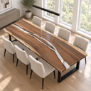 High corner view of a walnut dining table with a clear epoxy resin river in a bright dining room
