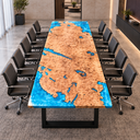 Front end view of a poplar blue epoxy resin conference table with black office chairs in a neutral meeting room