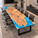 Reverse angled view of a poplar conference table with blue epoxy resin borders and black office chairs