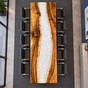 Overhead lengthwise view of a walnut conference table with a winding white epoxy resin river between wood slabs